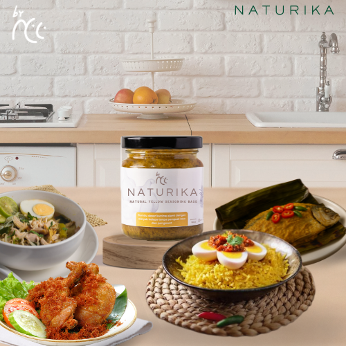 By NCC Naturika Bumbu Dasar Kuning 160gr jar of natural yellow seasoning base with assorted Indonesian dishes on kitchen counter