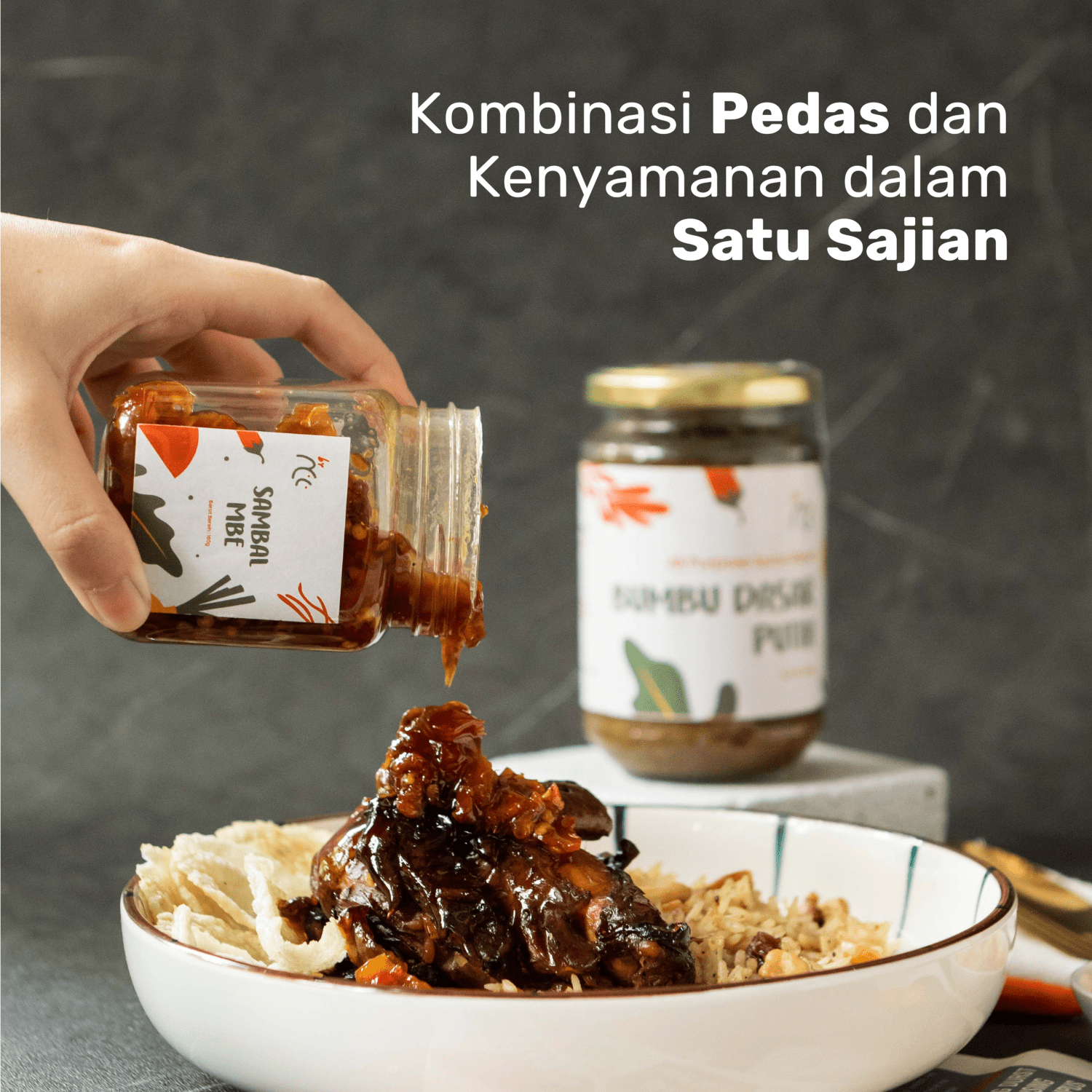 By NCC Sambal Mbe Pedas Gurih rumahan poured on traditional Indonesian dish with crispy fried shallots in jar
